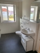 Badezimmer 1 - Charmante 3-Zimmer-Wohnung mit Balkon und KFZ-Stellplatz!