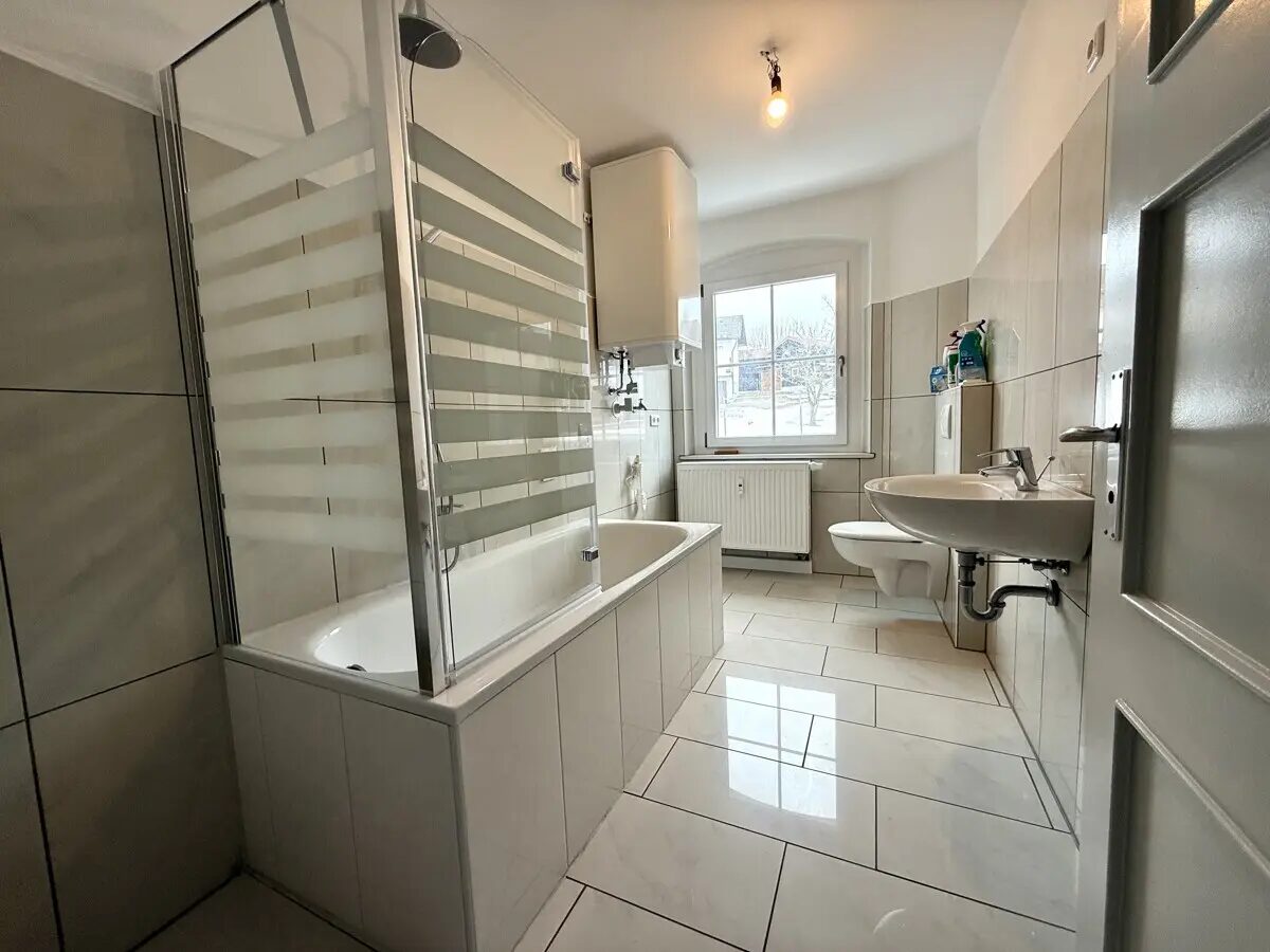 Kernsaniert: 3-Zimmer-Wohnung mit Garage und gemeinschaftlichem Garten - Foto 3