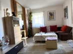 Wohnzimmer - Charmante 2-Zimmer-Erdgeschosswohnung mit Terrasse in Nittendorf – ideal für Kapitalanleger